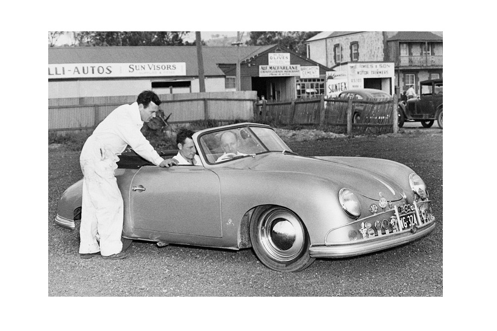Norman Hamilton, in the passenger seat at right, purchased one of the first right-hand-drive Cabriolets in early September 1951, in Melbourne, Australia. Friend and driver Ken Harper, and mechanic Ken McConville, prepare for another drive. Porsche Archiv